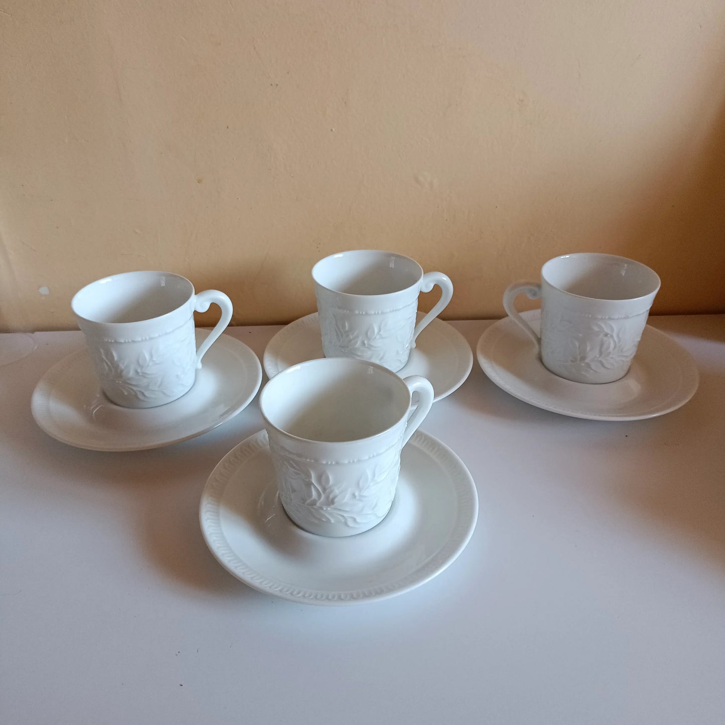 4 Bernardaud white porcelain coffee cups and saucers