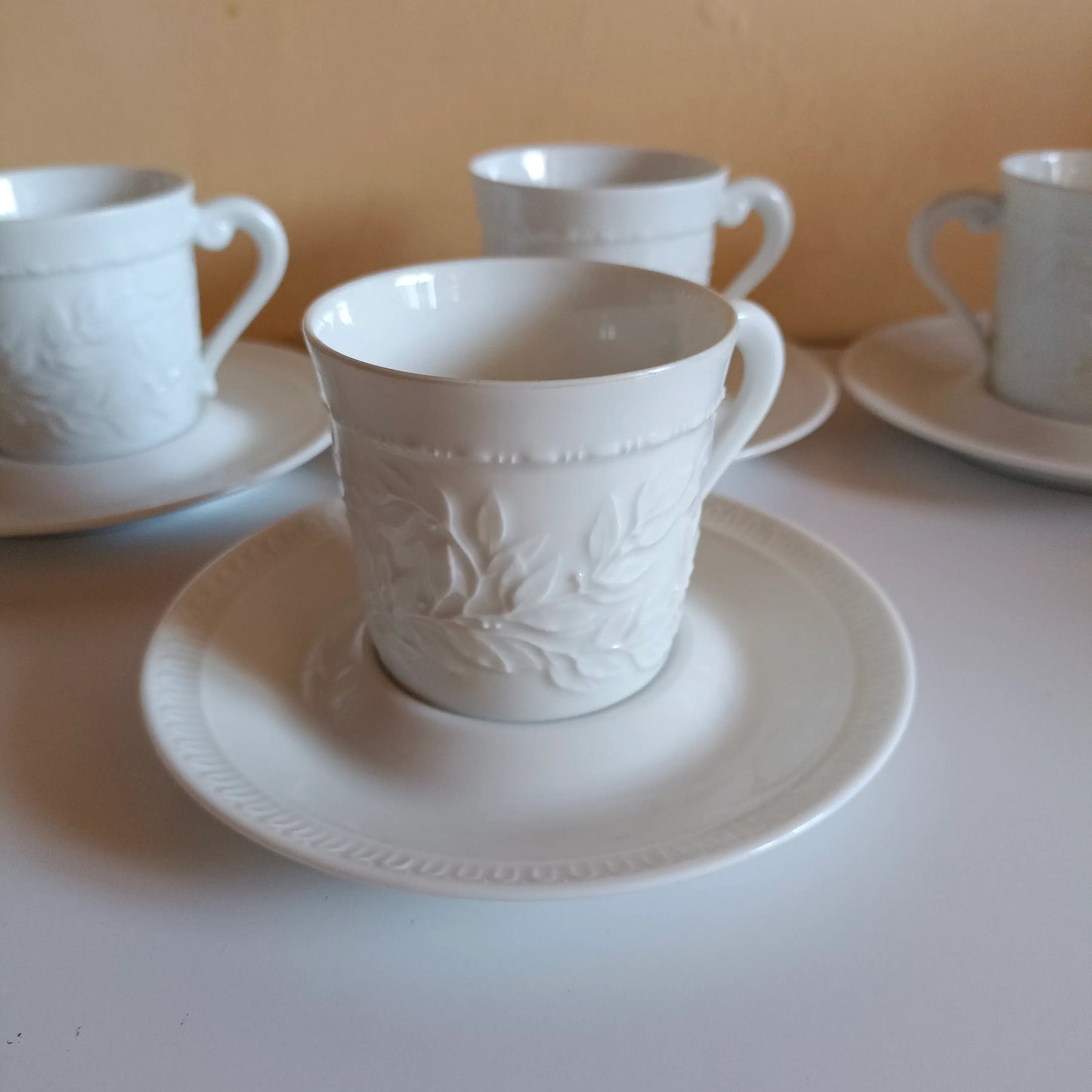 4 Bernardaud white porcelain coffee cups and saucers