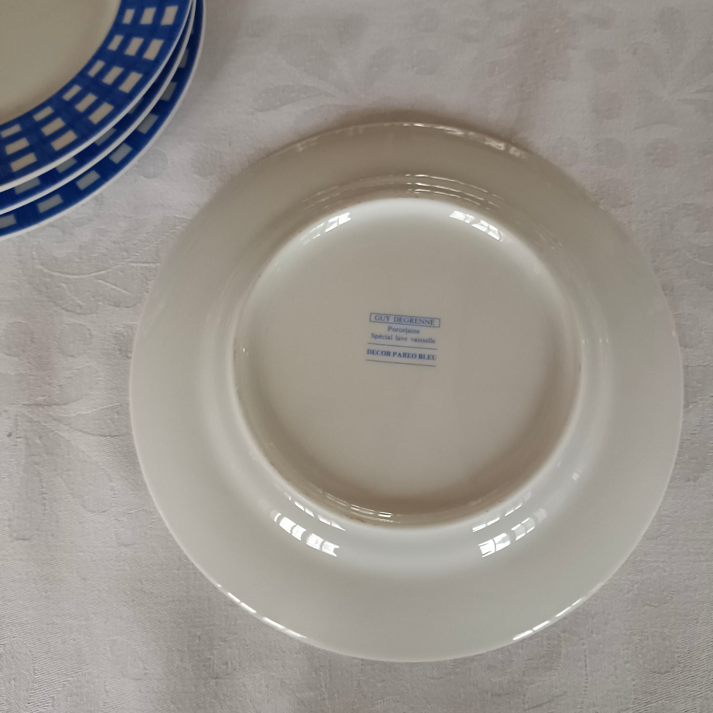4 assiettes à dessert en porcelaine Guy Degrenne, modèle "Paréo" bleu