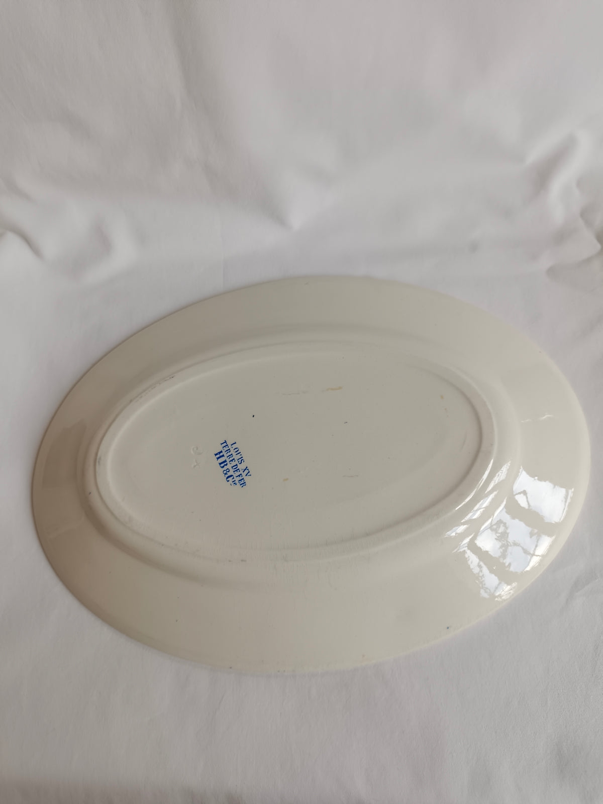 Plat ovale en terre de fer HB & Cie Choisy-le-Roi, modèle "Louis XV"